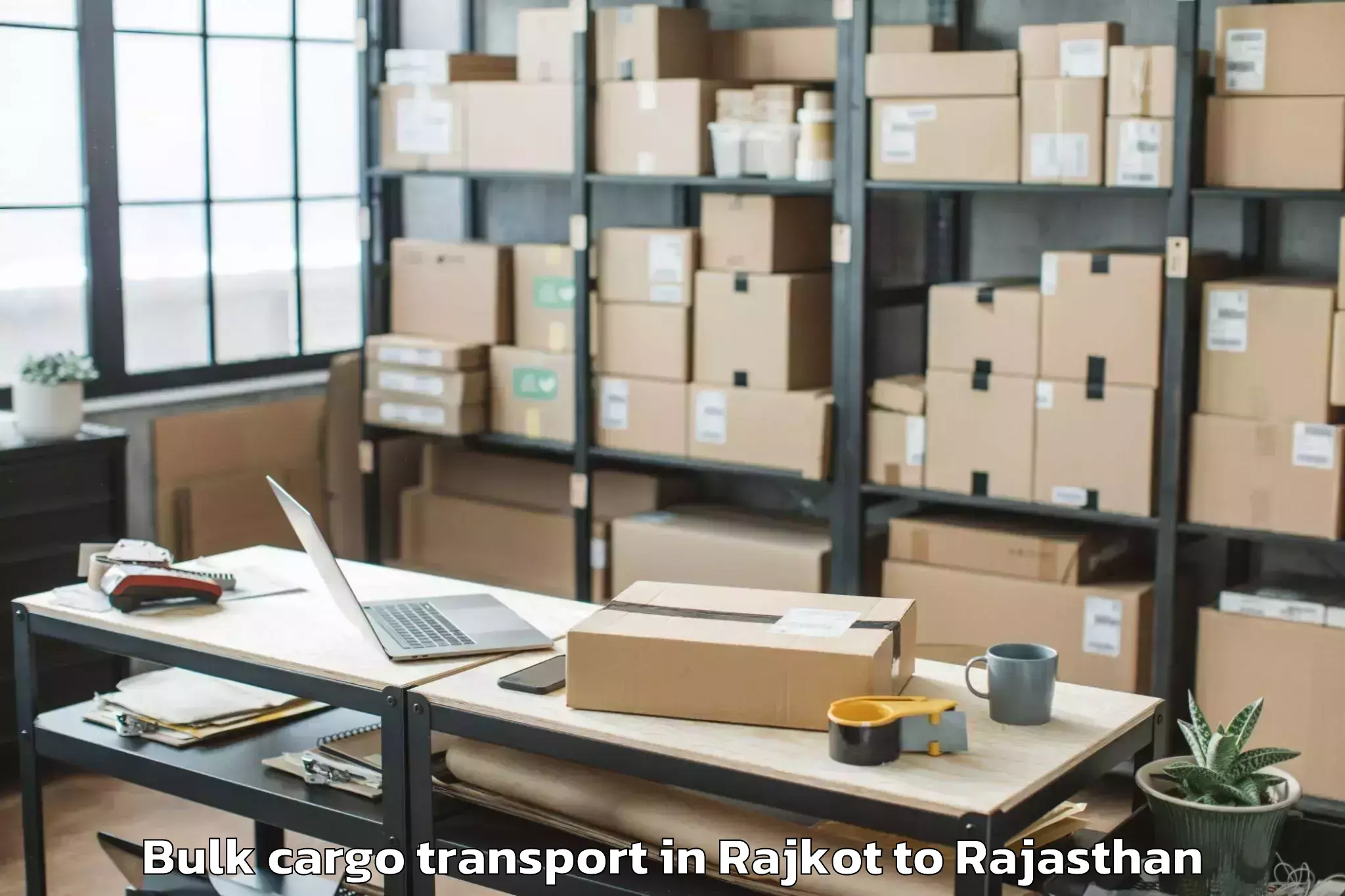 Reliable Rajkot to Opjs University Churu Bulk Cargo Transport